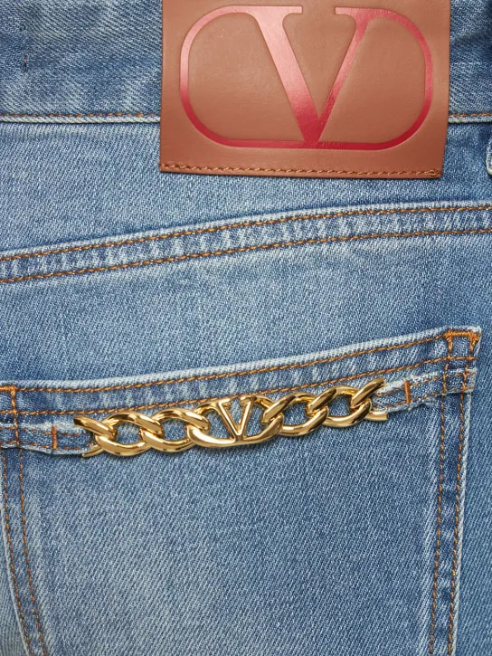 Valentino   Chain logo flared denim jeans 