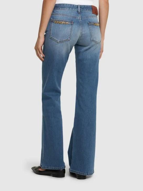 Valentino   Chain logo flared denim jeans 